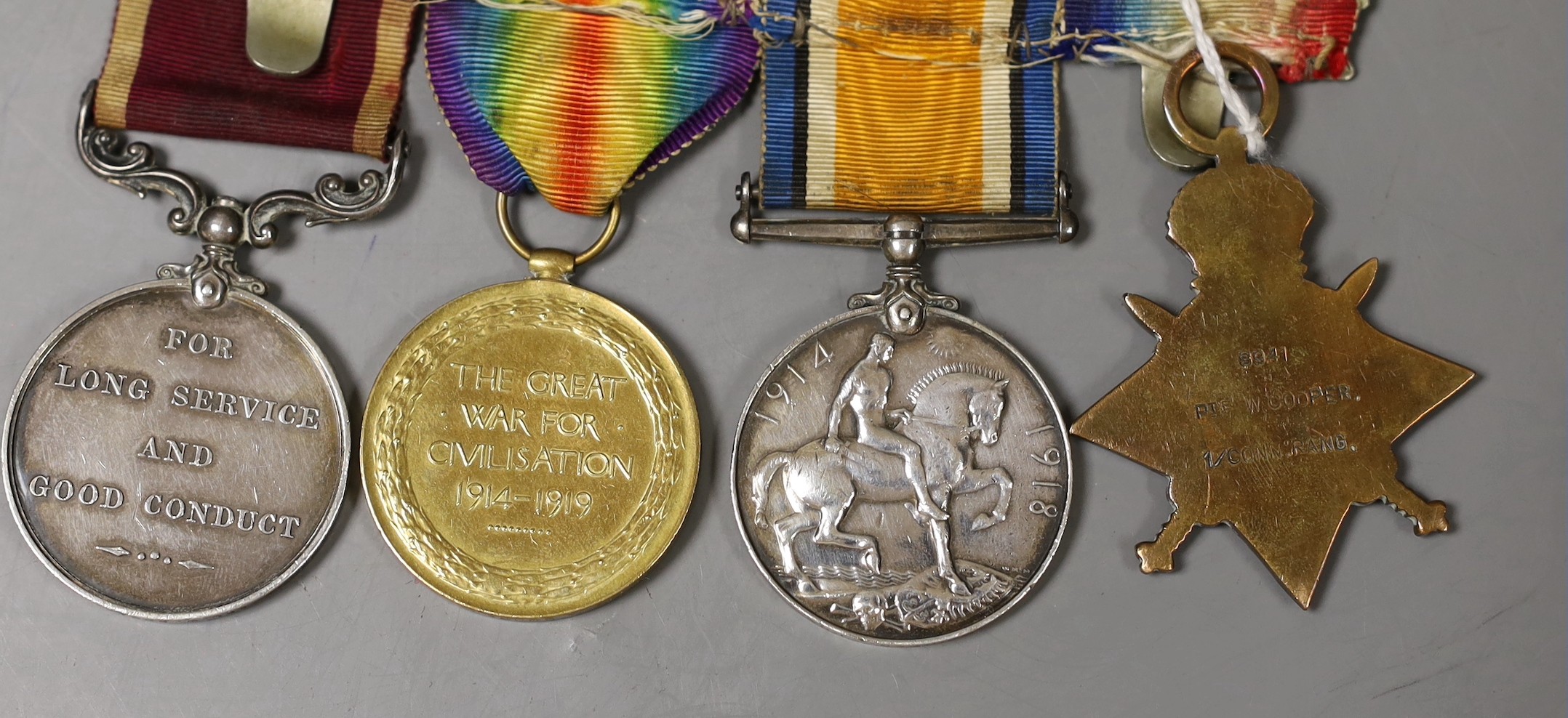 WWI medals: a group of four including Long Service 7144338 CPL. W. COOPER. CONN. RANG and 8941 PTE. W. COOPER. CONN. RANG.